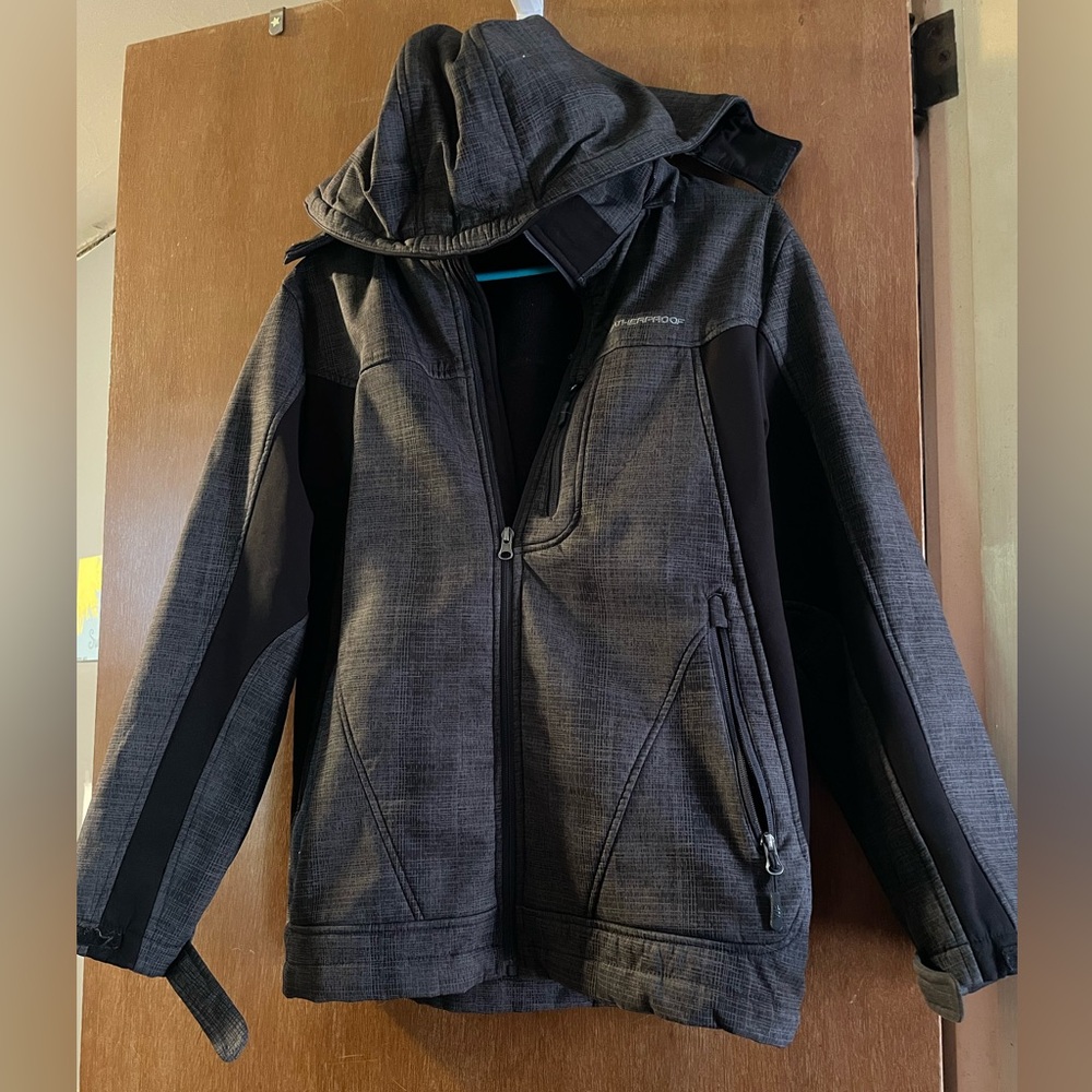 Weatherproof boys heavy raincoat with lining .
